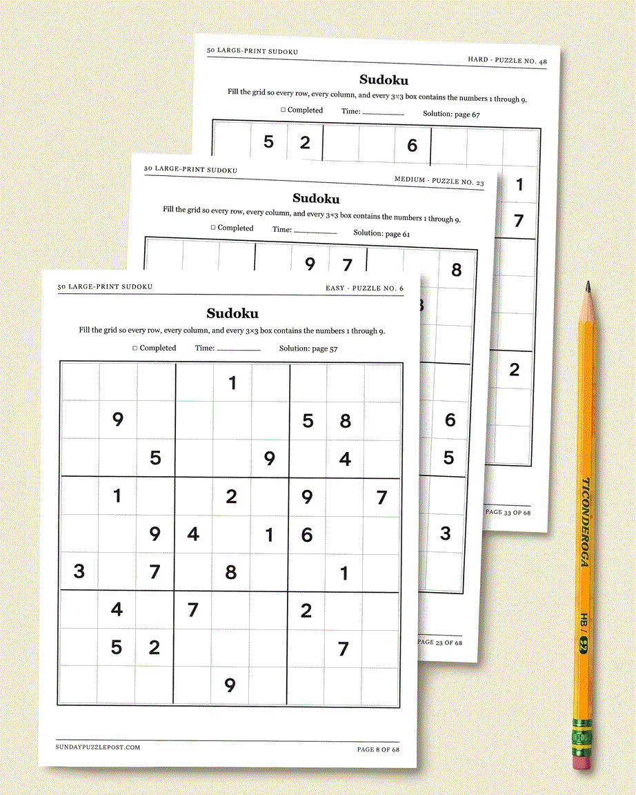 Three large-print Sudoku pages from the book &mdash; an easy, a medium, and a hard puzzle &mdash; fanned out beside a pencil.